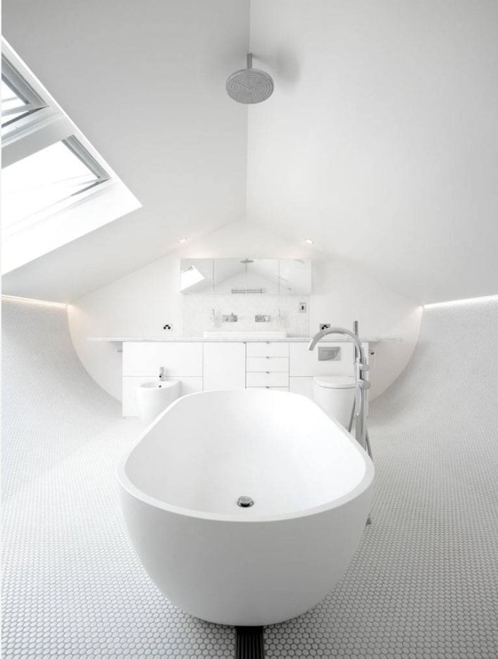 Unusual hi-tech interior in minimalistic shining white bathroom
