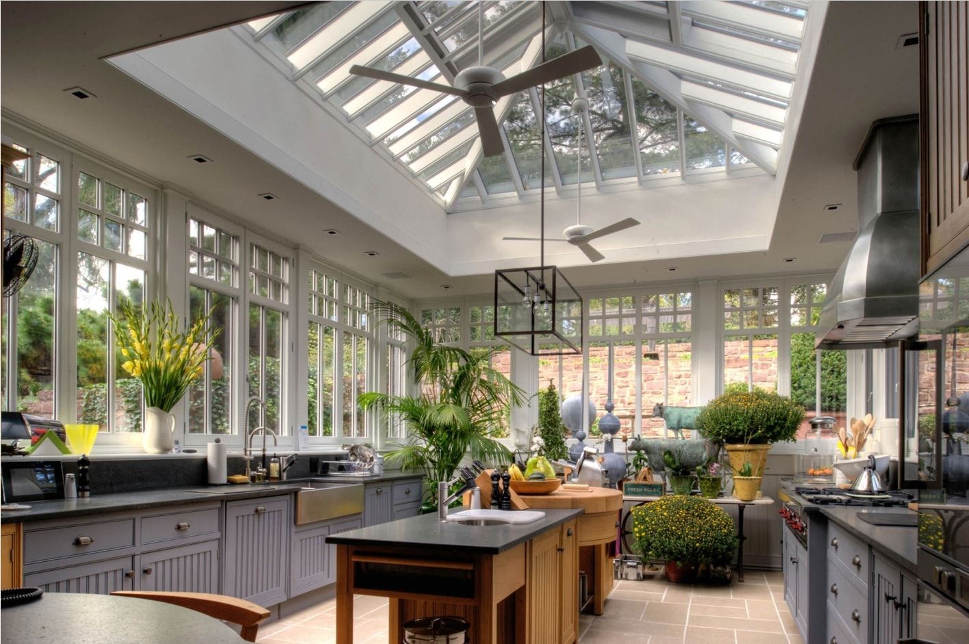 Gorgeous large sunroom looking kitchen with cathedral glass ceiling