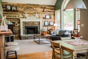 Wooden planked accent wall with concrete framing around hearth