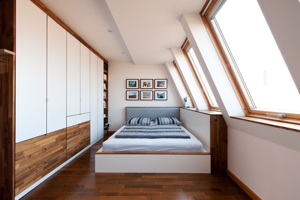 Modular furniture and light color theme for the loft bedroom with wooden inlays