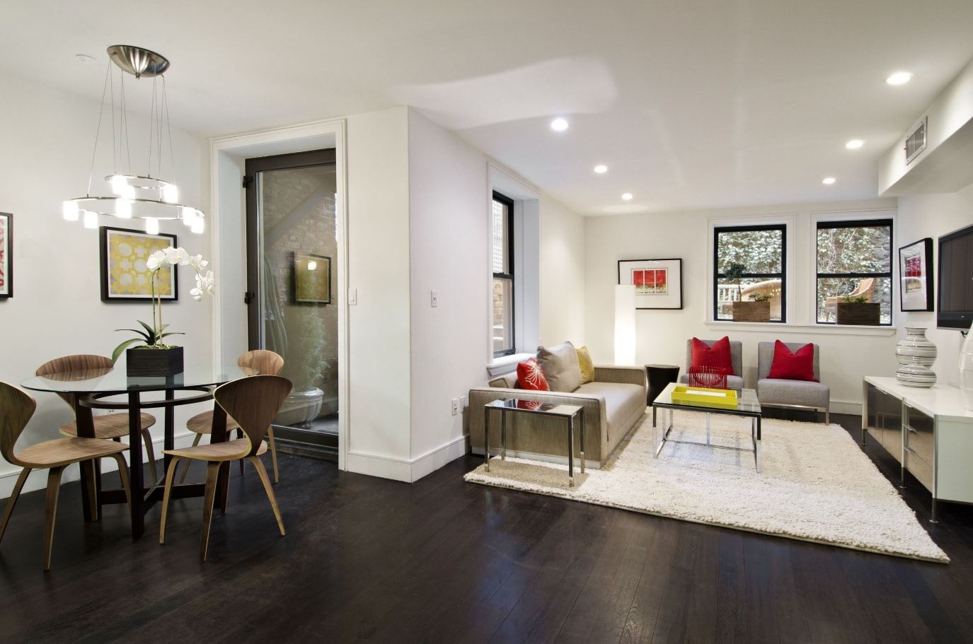 Dark floor and light colored walls for open layout condo