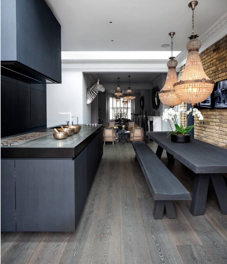 Non-traditional modern kitchen with black furniture and dark wood laminate
