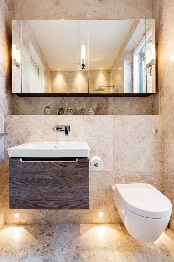Complex designed modern bathroom with hovering vanity and suspended toilet