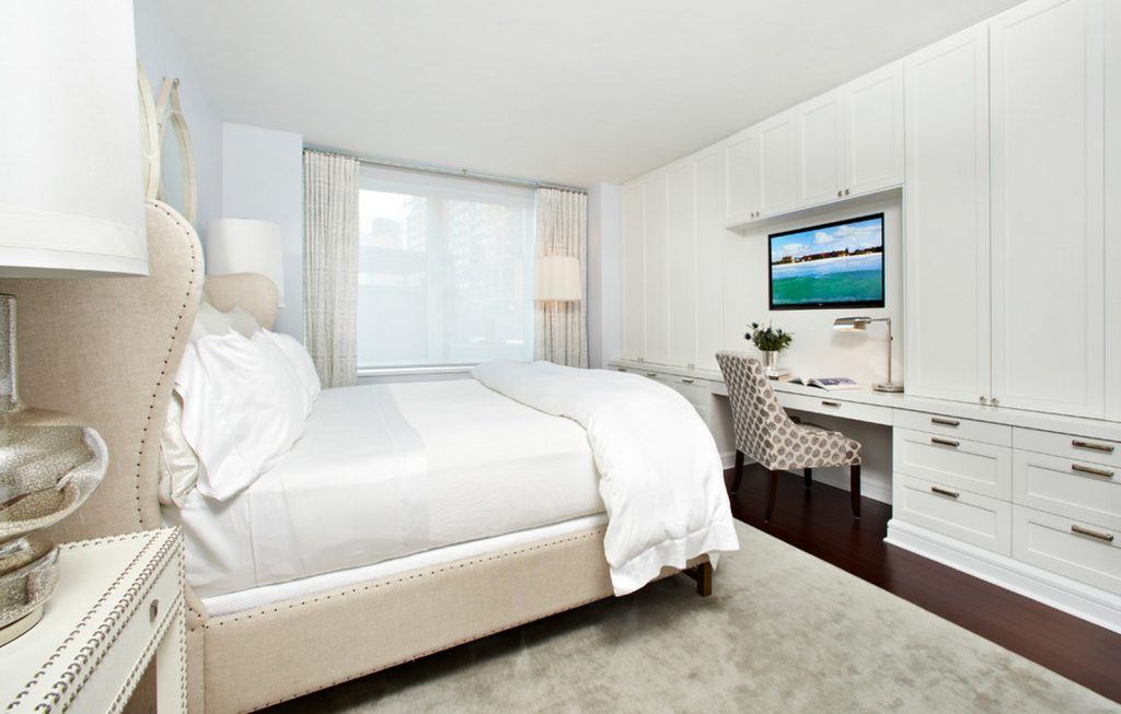 Light Scandinavian styled bedroom with plenty of textile