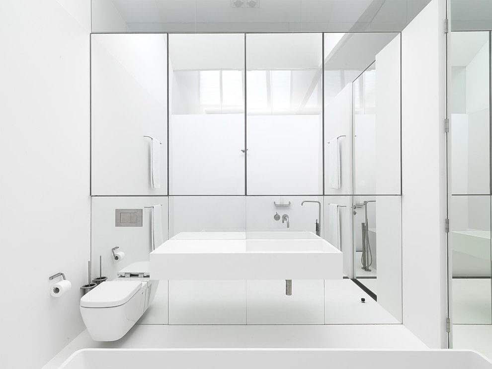 Modular furniture and large mirror for bathroom with wall-hung toilet and airy vanity
