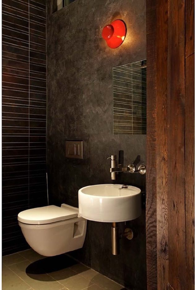 Dark gray interior of the bathroom with wooden elements