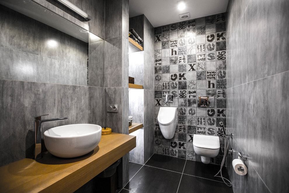 Wall Hung Toilet: Comfort and Cleanliness in Your Home. Indian tile in the gray themed bathroom with wooden vanity