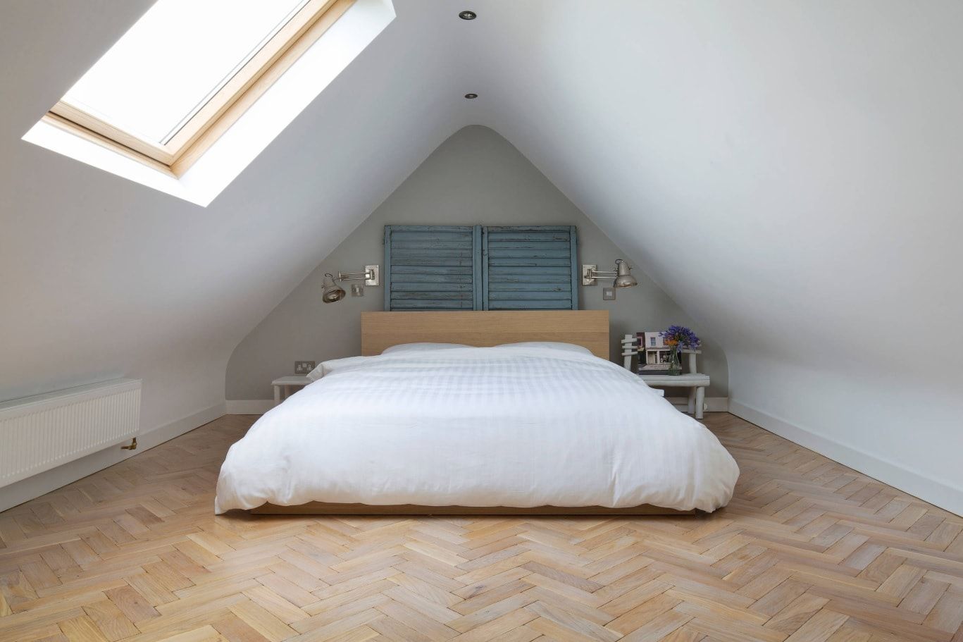 Organizing Comfortable and Functional Attic Room Advice with Photos. Modern Scandinavian style of the bedroom with platform bed