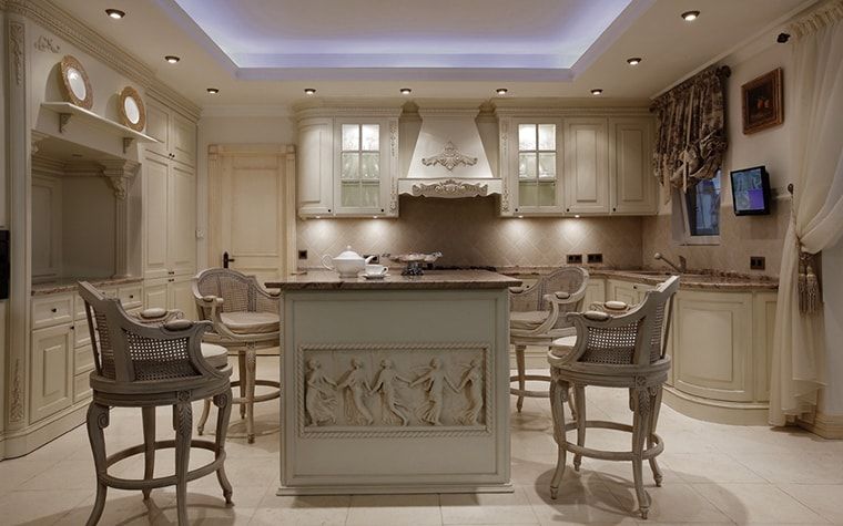 Italian Dining Room & Kitchen Combined in One Space. Mediterranean style touch with ancient fresco at the island and carved chairs