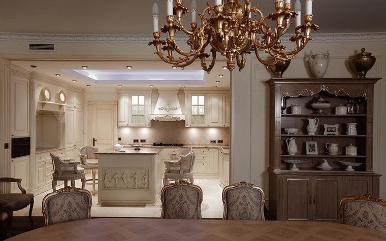 Italian Dining Room & Kitchen Combined in One Space. Royal gilded chandelier with Classic set interior and modern LED backlight