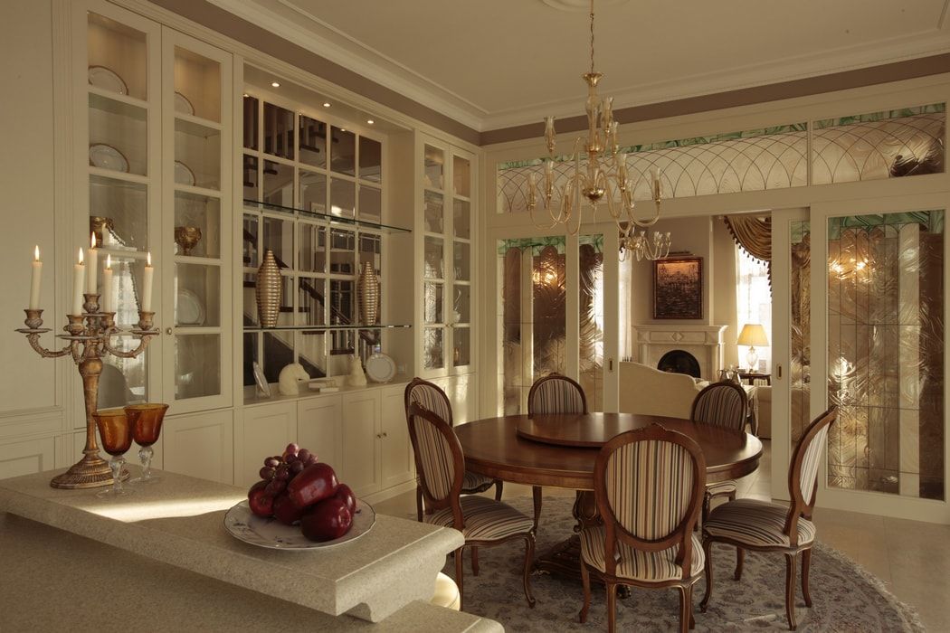 Italian Dining Room & Kitchen Combined in One Space. Beige colored ethnic design of the kitchen