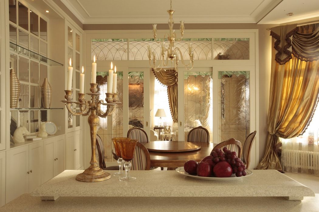 Italian Dining Room & Kitchen Combined in One Space. Chandelier and candlestick call up in same stylistic