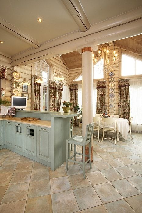 Turquoise large island in the classic designed kitchen makes it more fairytale