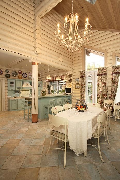 Wooden logs built kitchen in creamy color and ceramic tiled floor