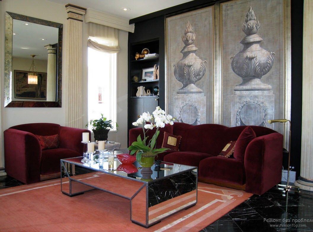 Greek Interior Design Style: Antiquity in Your Home. Mirroring coffee table and deep red upholstered furniture for Classic living room