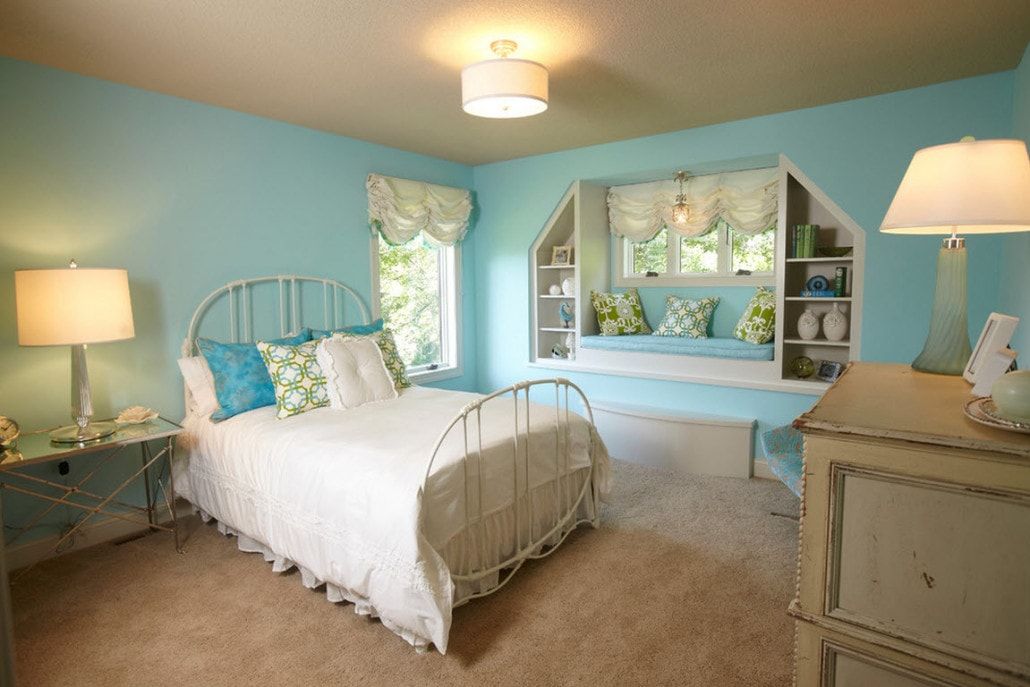 Azure cold colored kids' room with metal framed bed