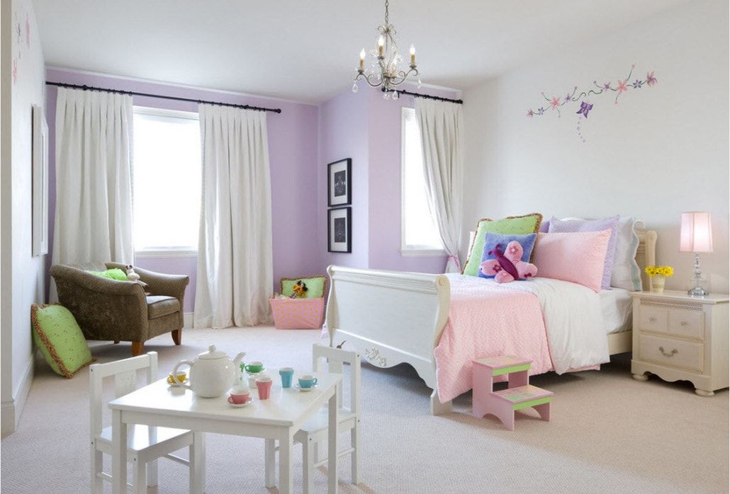 Large kids' room with the playground, violet walls and white tulle curtains