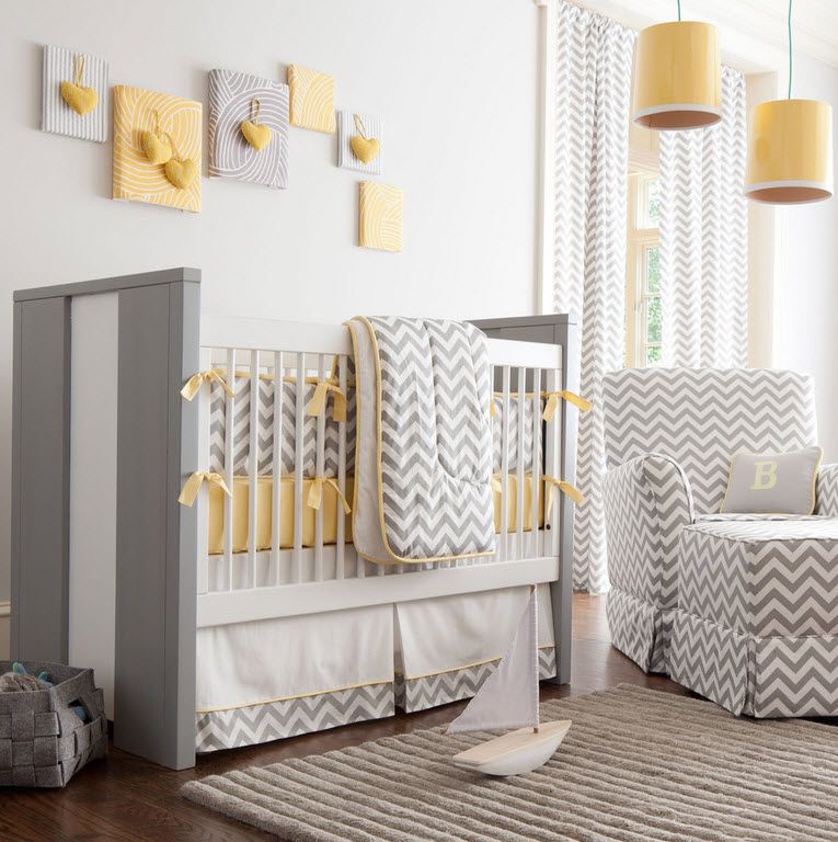 Gray modern crib in the neutral toned room