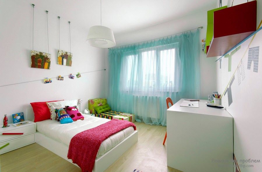 Curtains in the Interior of the Children’s Room. Turquoise tulle on the window and the crimson coverlet on the bed