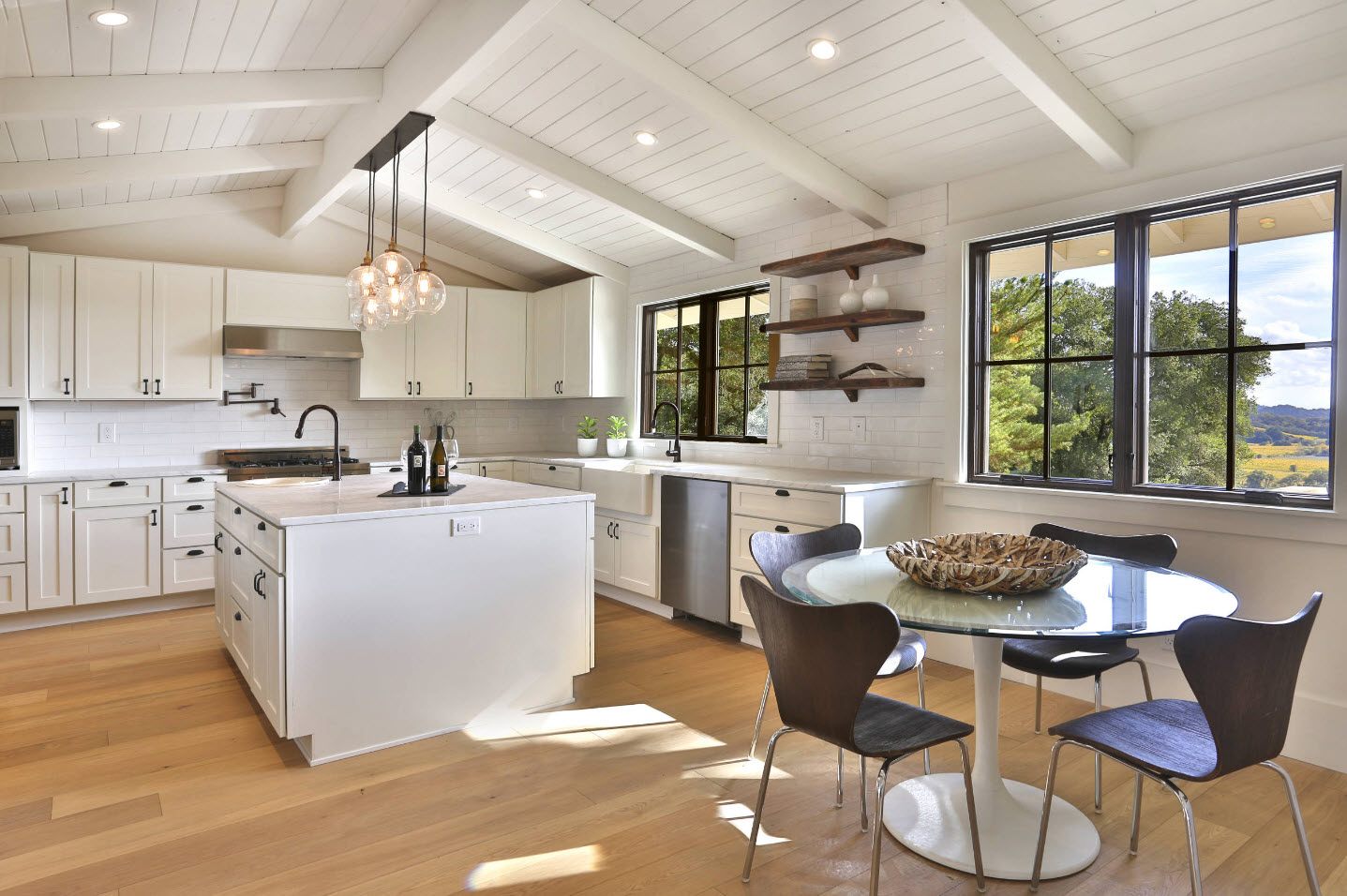 Modern loft cottage concept of the kitchen with large island and plenty of natural light