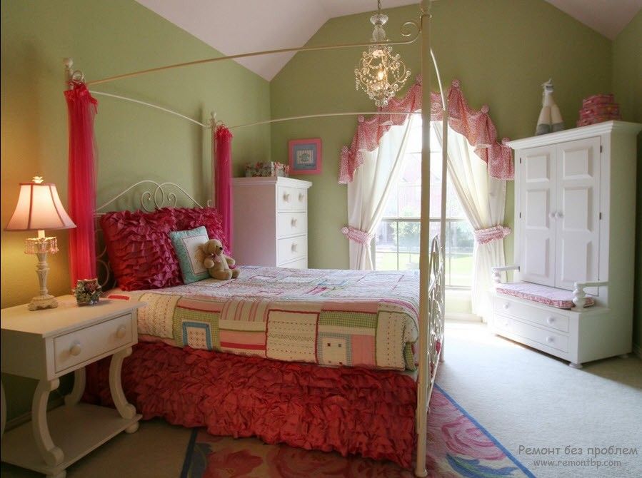 Curtains in the Interior of the Children’s Room. Girlish interior with pink bed and green painted walls