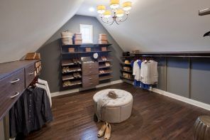Attic Walk in Closet Ideas: Designing your Loft with Style and Functionality. Dark wooden floor and round ottoman for shoes fitting