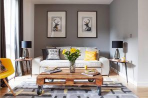The Best DIY Hacks to Transform Your Home. Gray painted walls and pallet constructed coffe table in the living room