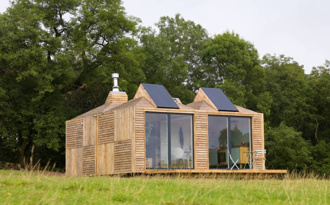 Switching Your Property To Solar Power: Why Do It. Wooden house at the open lawn
