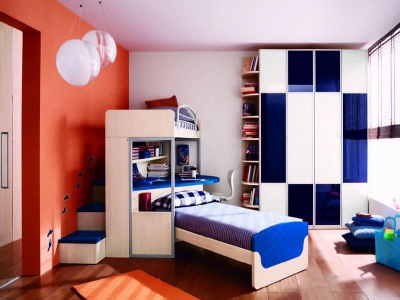 Choosing the Furniture for Children's Room: Arrangement for Boy, for Girl. Orange bright wall to dilute the blue color