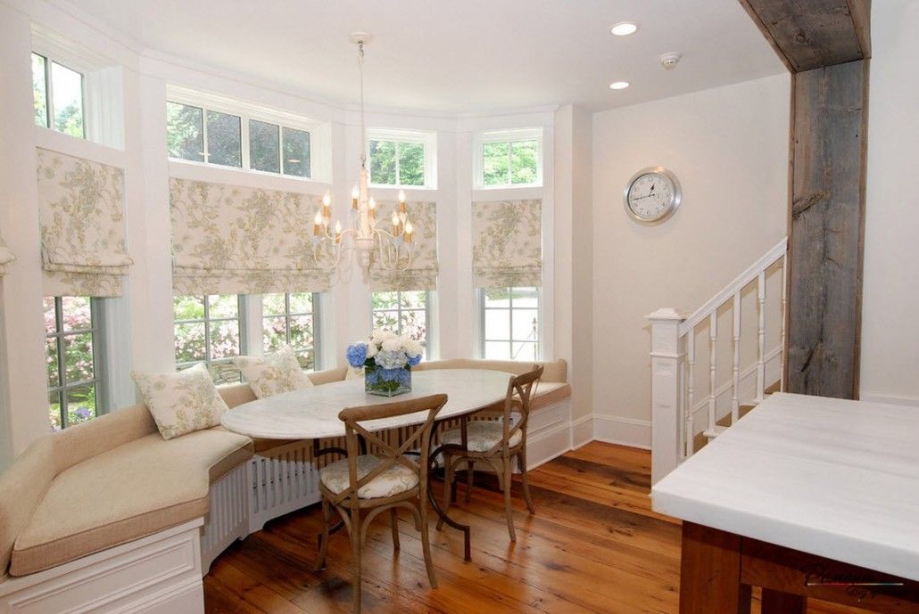 Light pastel colored dining zone at the stairs with wooden floor