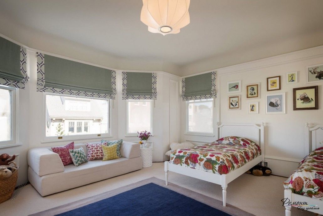 White Classic designed bedroom with a bed and sofa decorated with many pillows