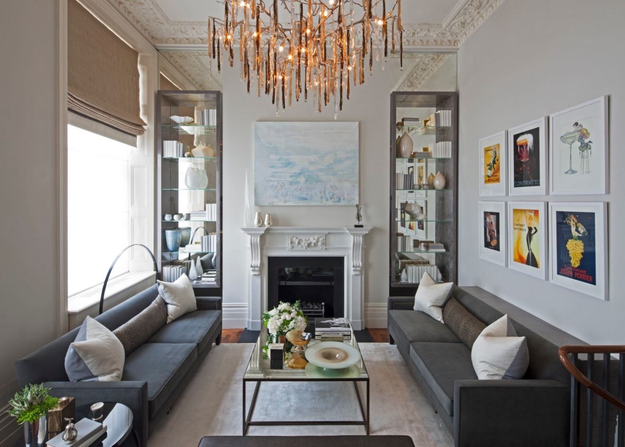 Drawing Room Interior Design in Different Living Spaces and Styles. Gold plated chandelier in the Casual room with gray furniture