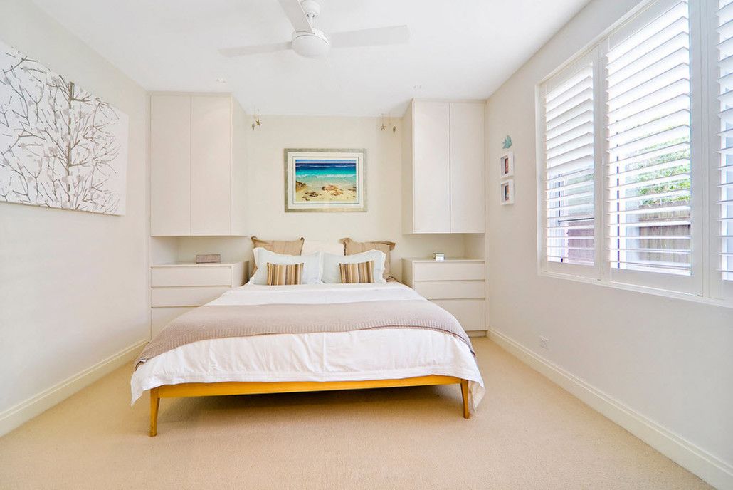 Modern bedroom with royal bed and modular suspended furniture