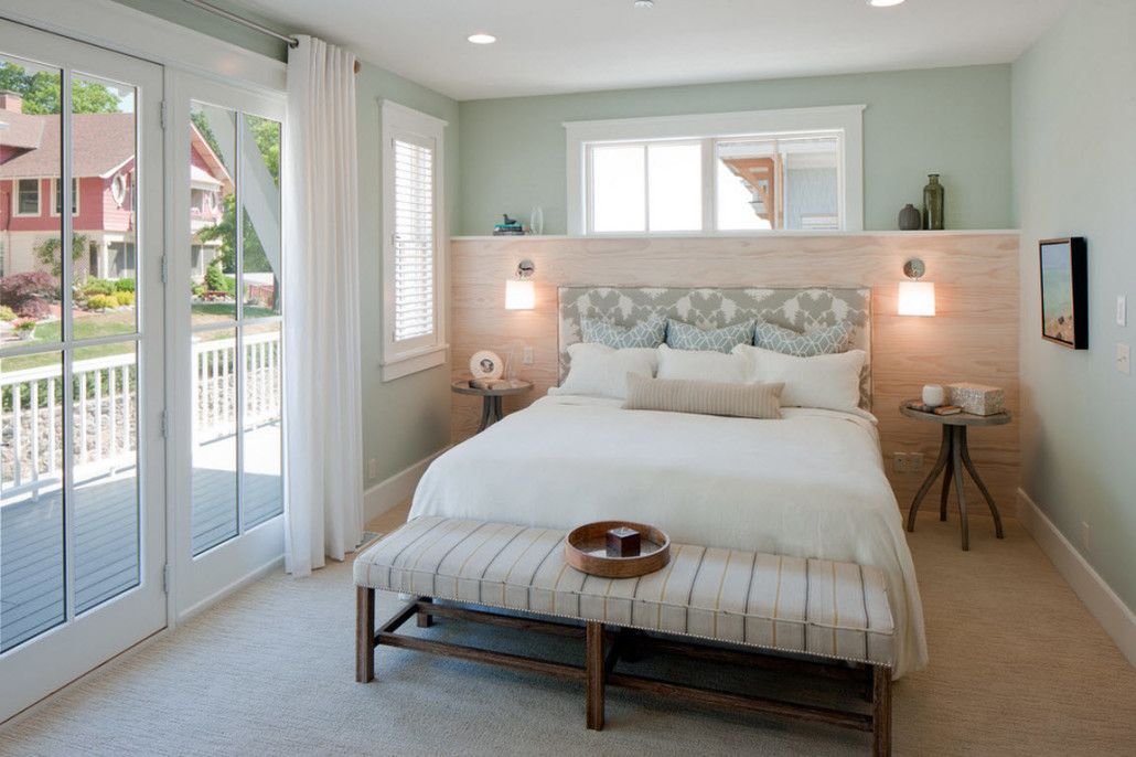 Nice turquoise colored guest bedroom with the entrance to the backyard