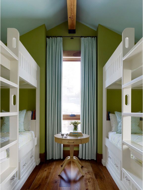 Gorgeous bedroom for four with two bunk beds and green accent wall