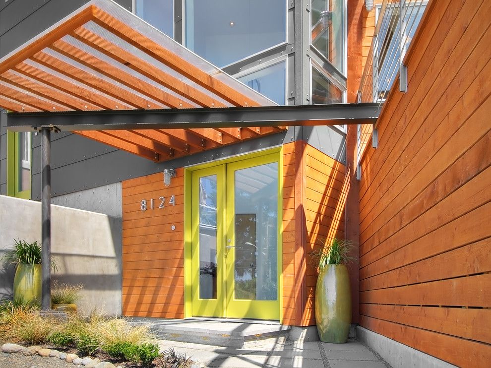 Gorgeous hi-tech styled house with planked canopy at the front door