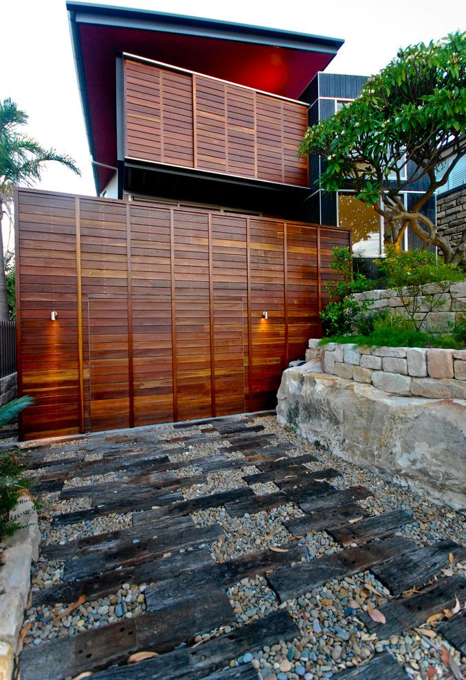 Timber Cladding House Facades of Different Styles and Materials. Wooden planked fence and wall of the natural trimmed houses