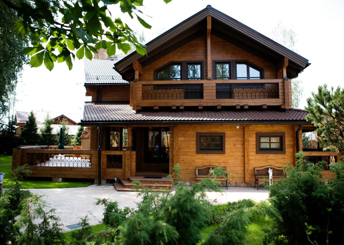 Timber Cladding House Facades of Different Styles and Materials. Classic designed Eco styled cottage in the village with large balcony