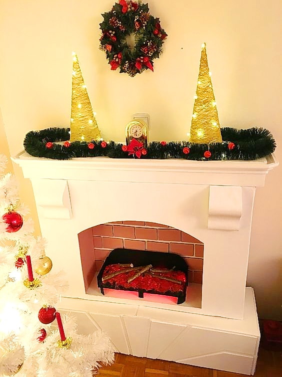 White matte DIY fireplace with Christmas decoration