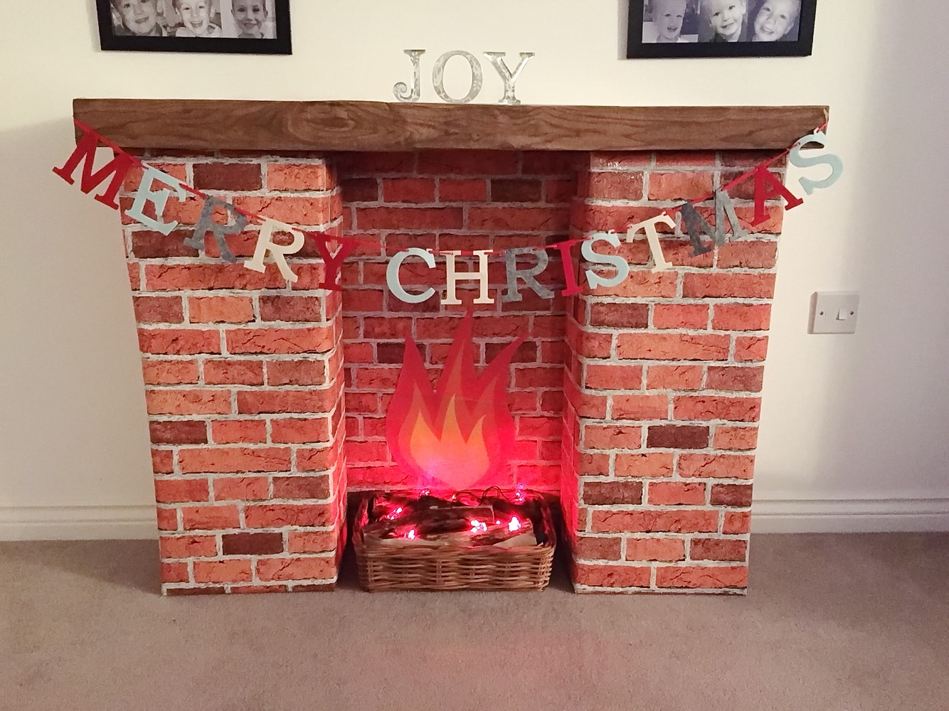DIY Fireplace of Cardboard Boxes: Stylish Affordable Element at Home. Christmas Eve decorating the fireplace