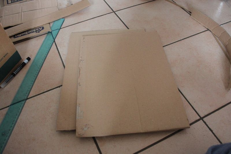 Additional pieces of cardboard for side walls of the fireplace