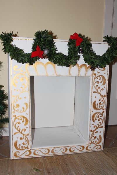 Nice DIY fireplace with garland and painting