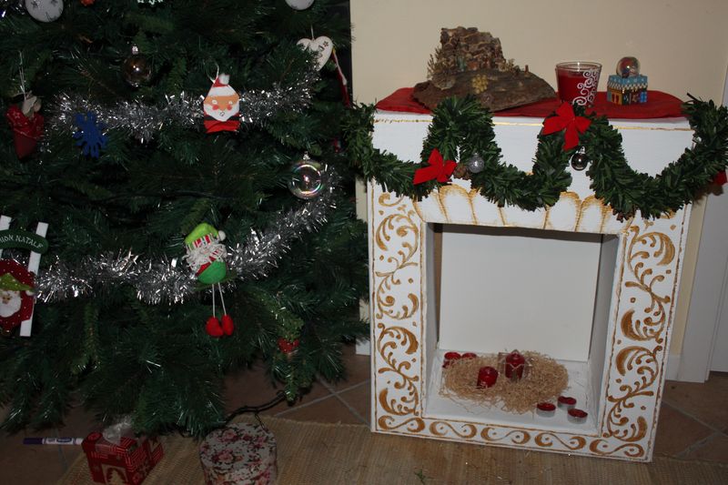 DIY Fireplace of Cardboard Boxes: Stylish Affordable Element at Home. Christmas hearth with your own hands