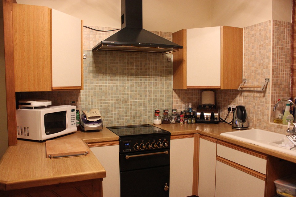 Considerations when Packing Appliances. Simple designed kitchen with microwave