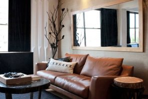 How to Make the Most of Small Space. Brown leather upholstered sofa and large rectangle mirror for the living room