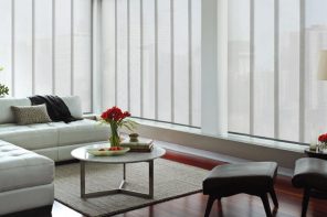 Using Vertical Blinds to Complement Interior Decor. White color theme for the neat Scandi styled living room with the fluffy rug and round table