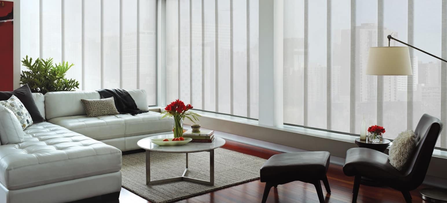 Using Vertical Blinds to Complement Interior Decor. White color theme for the neat Scandi styled living room with the fluffy rug and round table