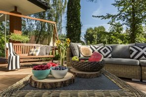Amazing Reasons Of Having An Outdoor Patio Installed In Summers. Opan-air sitting zone with the wooden swing and DIY wooden vase stands