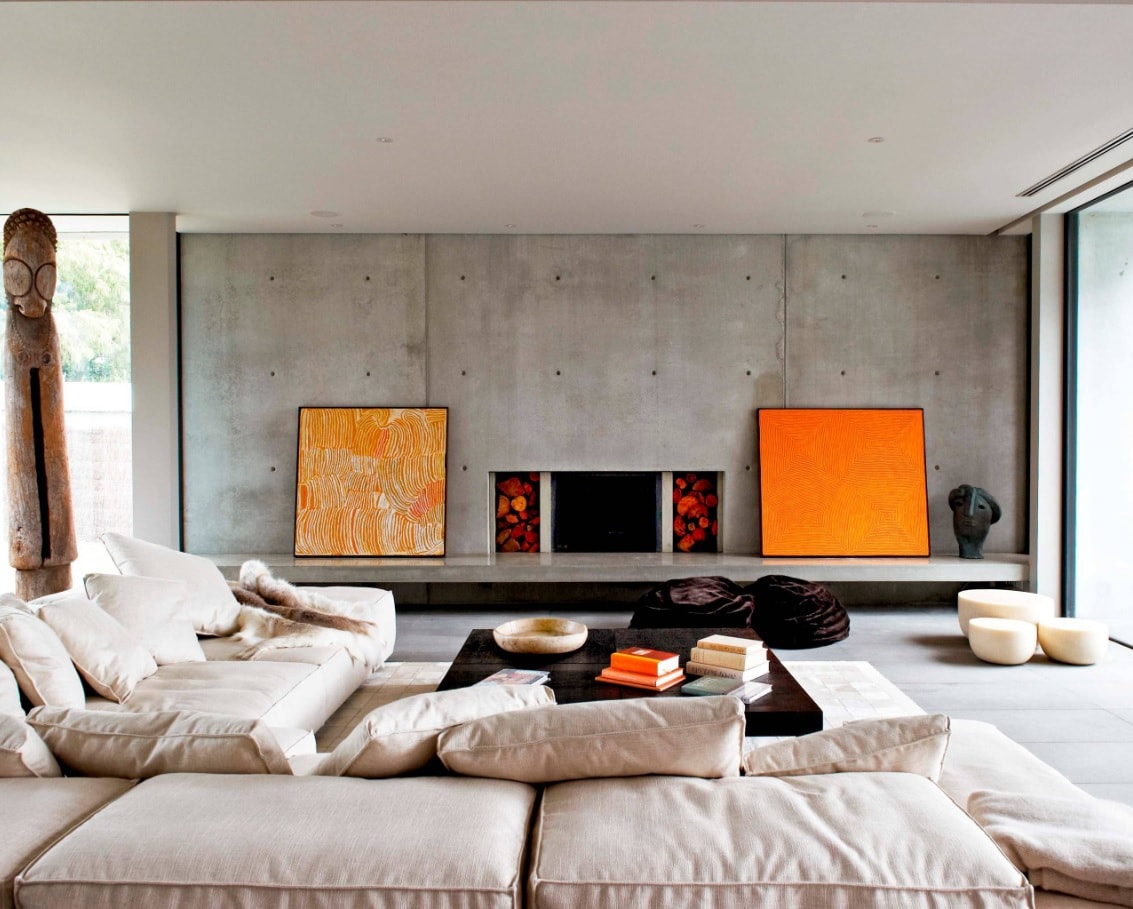 Lounge Room: What is It and Whether You Need it at Home? Gray accent functional wall with orange pictures and electrci fireplace