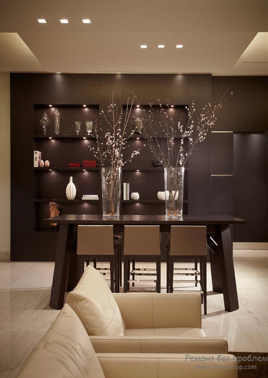 Dark accent wall with shelves for personal things in the dining room with dark wooden dining group